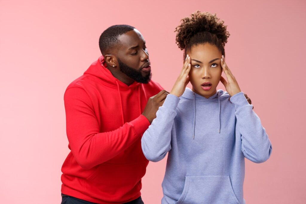 man apologizing girlfriend back touching shoulder comforting girl feel pressured irritated fed up lying hear boyfriend sorry arguing standing bothered pink background couple fighting 1258 81680