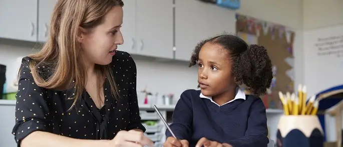 teacher listening to student